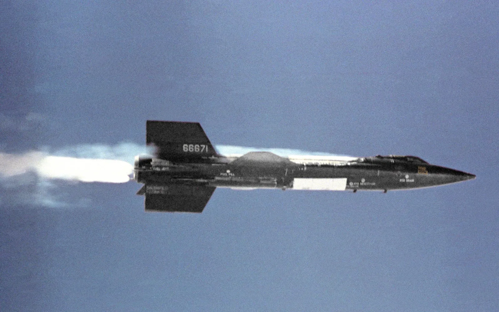 The North American X-15 rocket-powered aircraft separating from its B-52 mothership in flight during experimental aircraft testing
